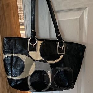 Black and gold Coach purse